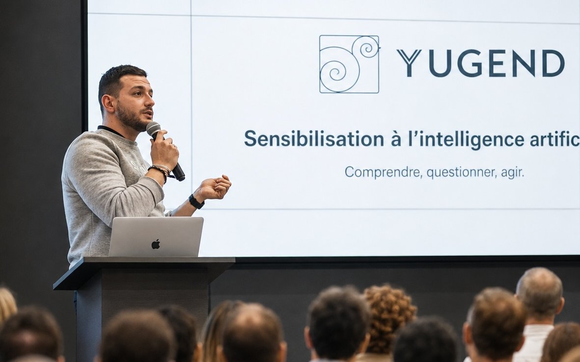 Maxime anime une session de sensibilisation à l'intelligence artificielle devant une salle de dirigeants
